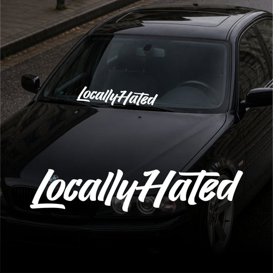 Black car with 'LocallyHated' decal on a street