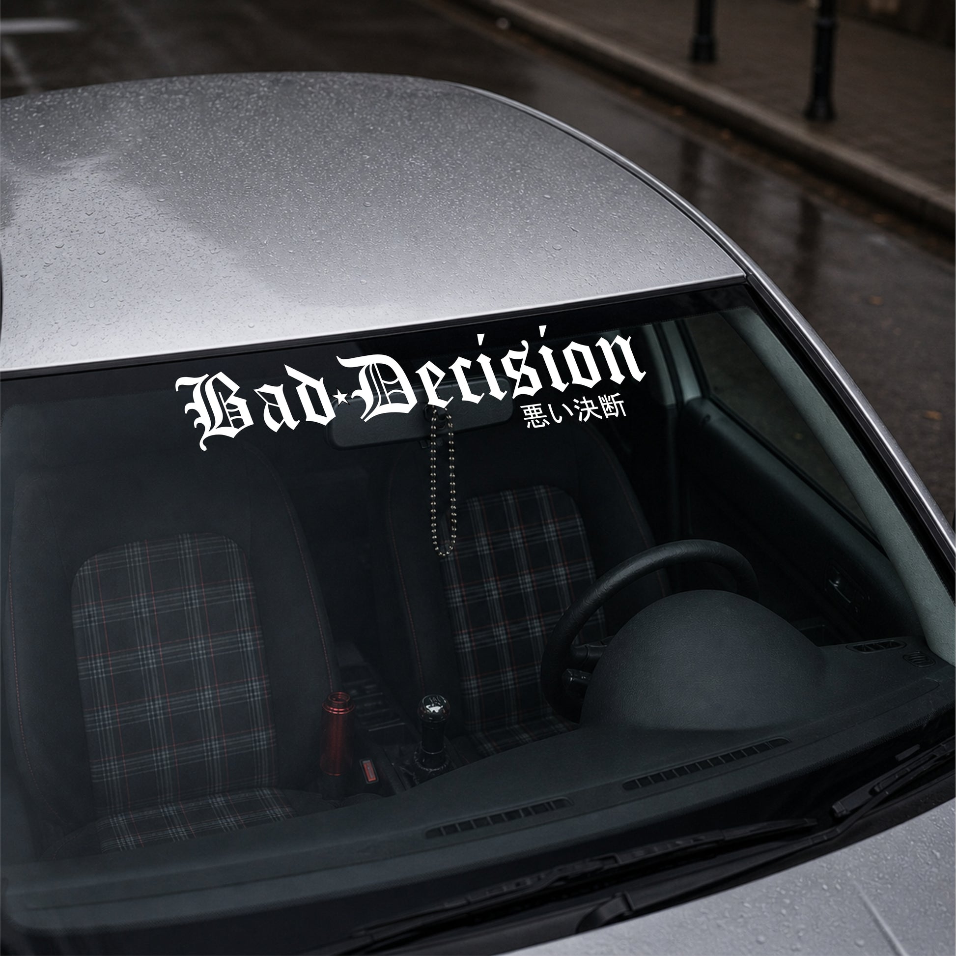 Car with 'Bad Decision' decal on the windshield
