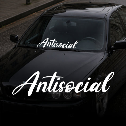 Black car with 'Antisocial' decal on a street