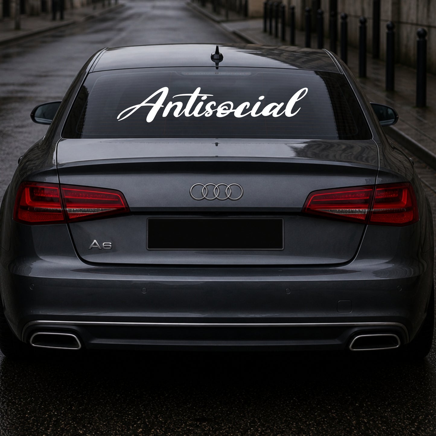 Audi car with 'Antisocial' decal on the back window