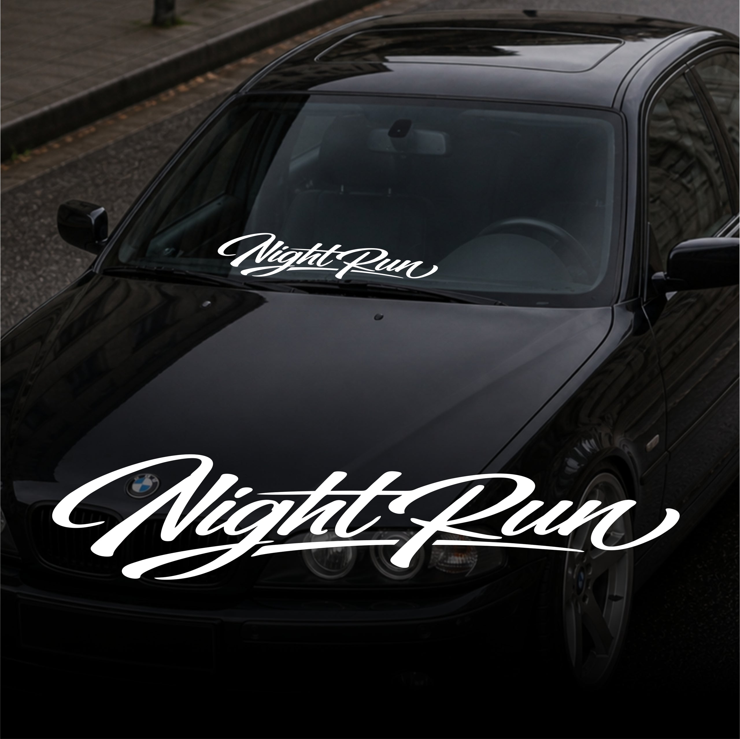 night run windshield banner decal on black car front view clean vinyl sunstrip