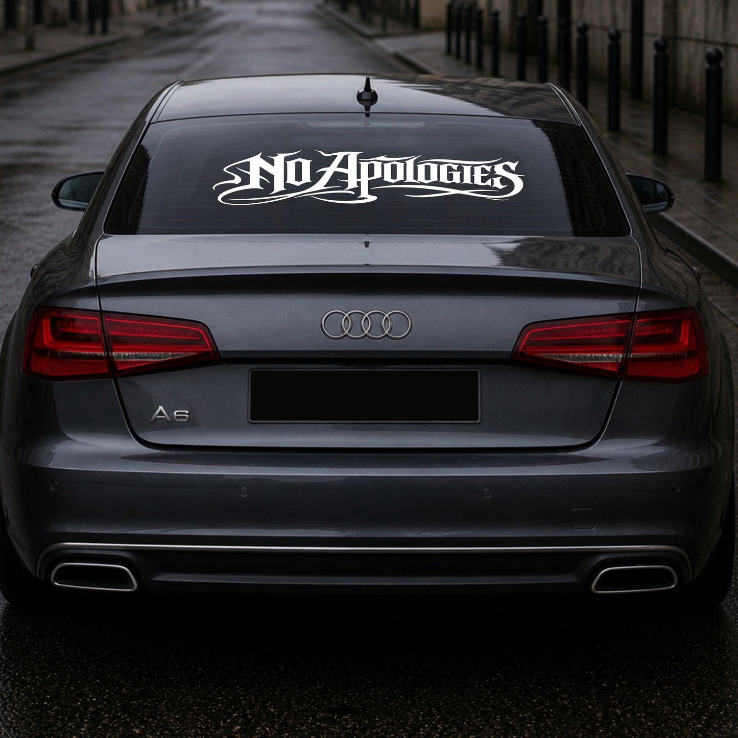 Audi car with 'No Apologies' decal on the back window.