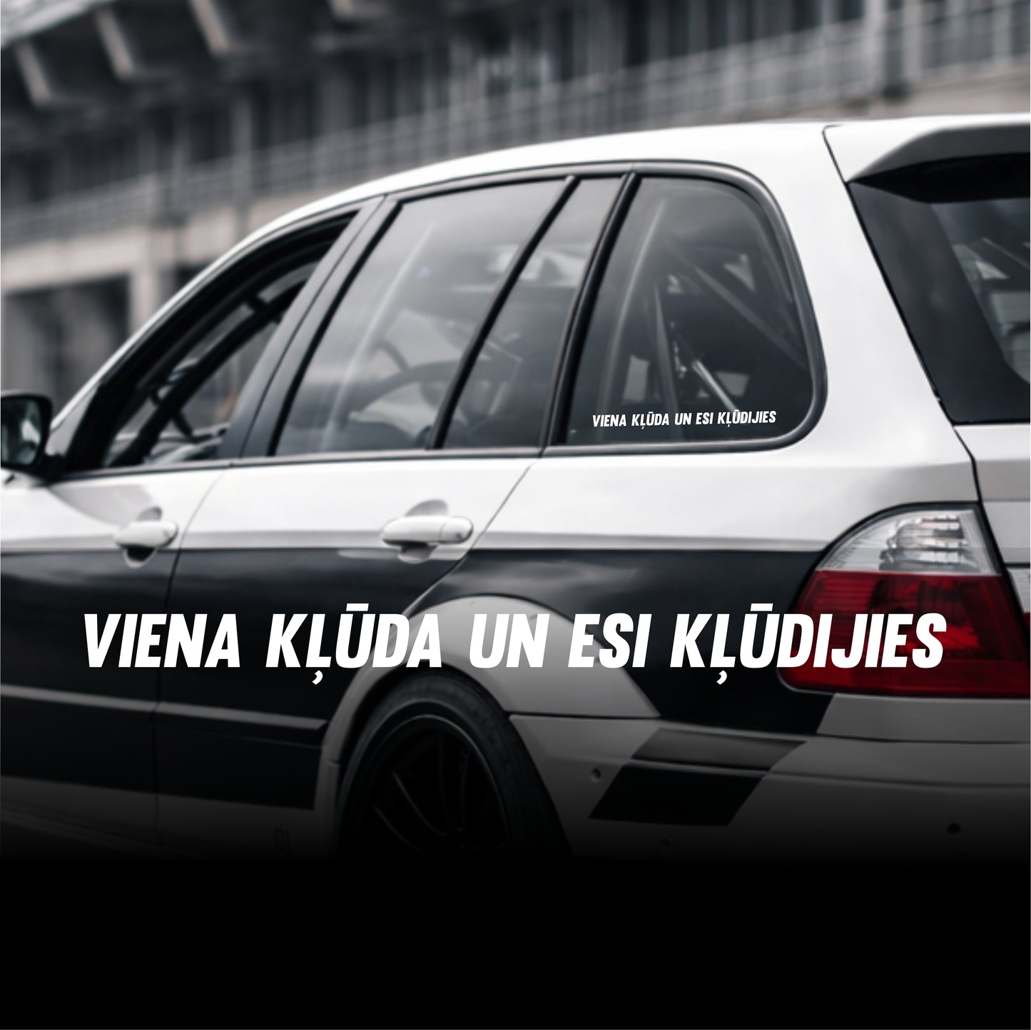 Car with text decal on a blurred background