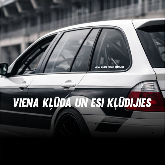 Car with text decal on a blurred background