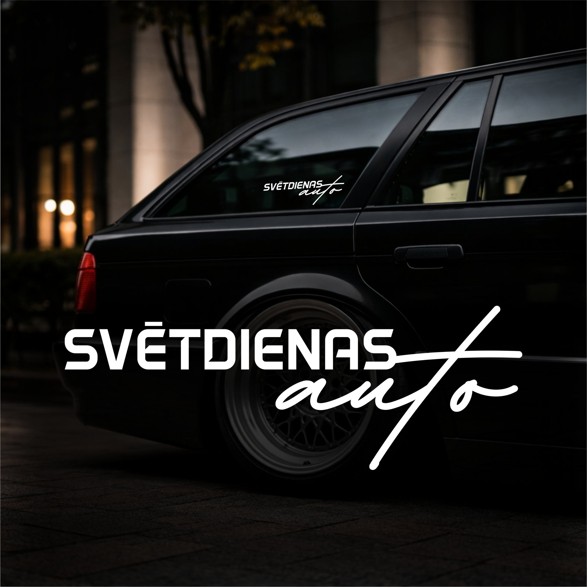 Black car with 'SVéTDIENAS auto' branding on a dark background