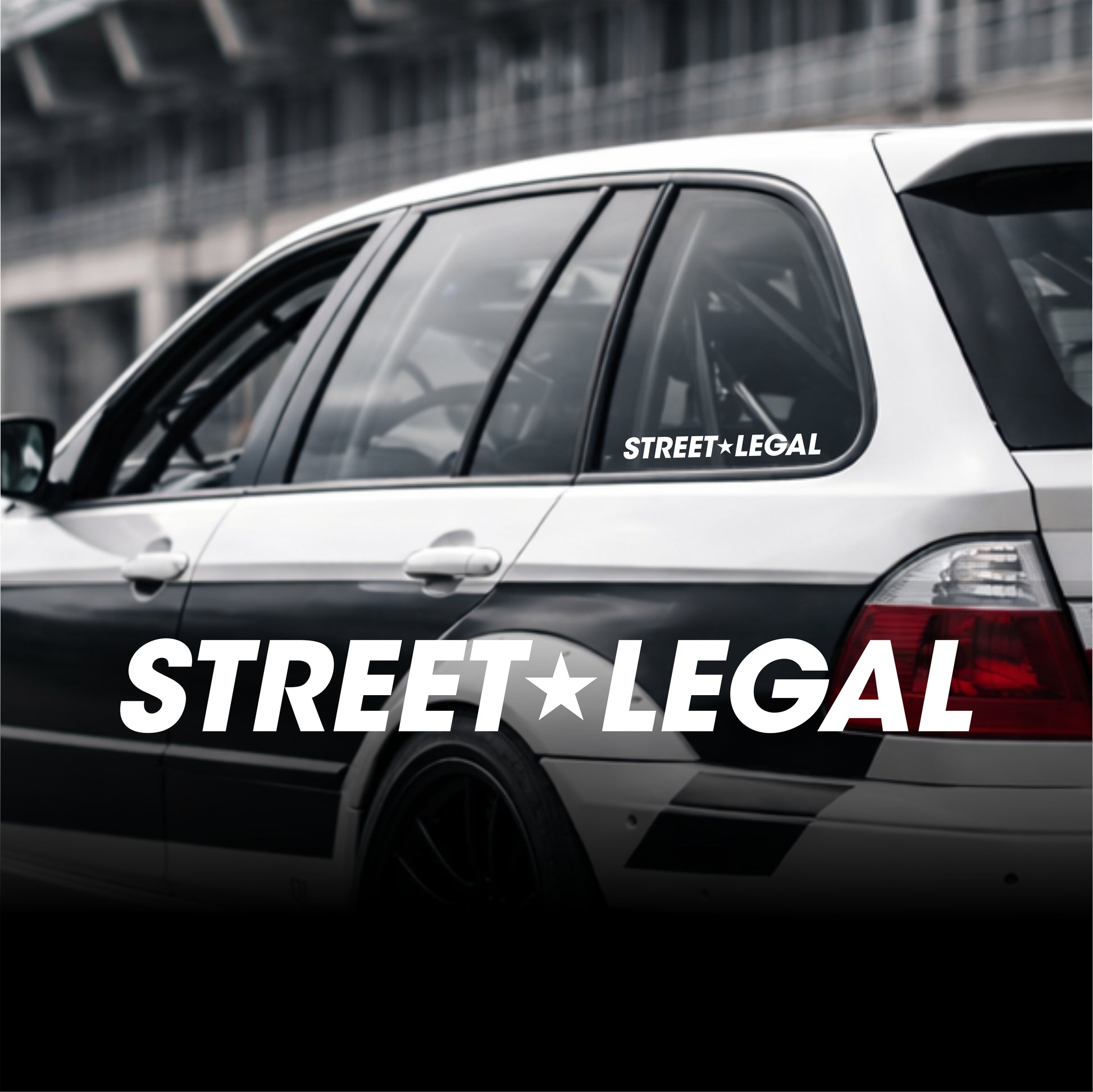 Car with 'Street Legal' decal on a blurred background
