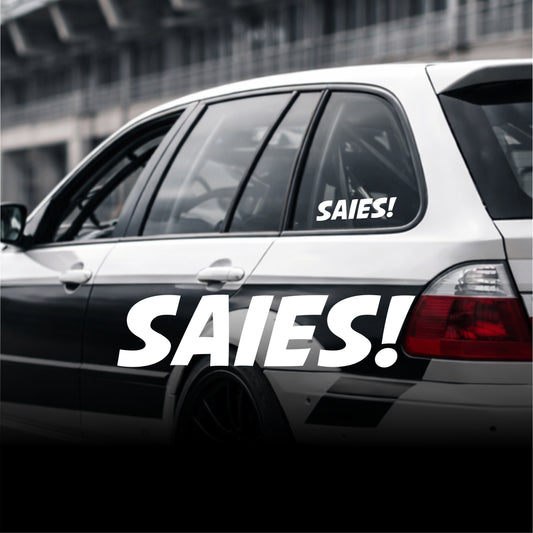 Car with 'SAIES!' decal on a blurred background