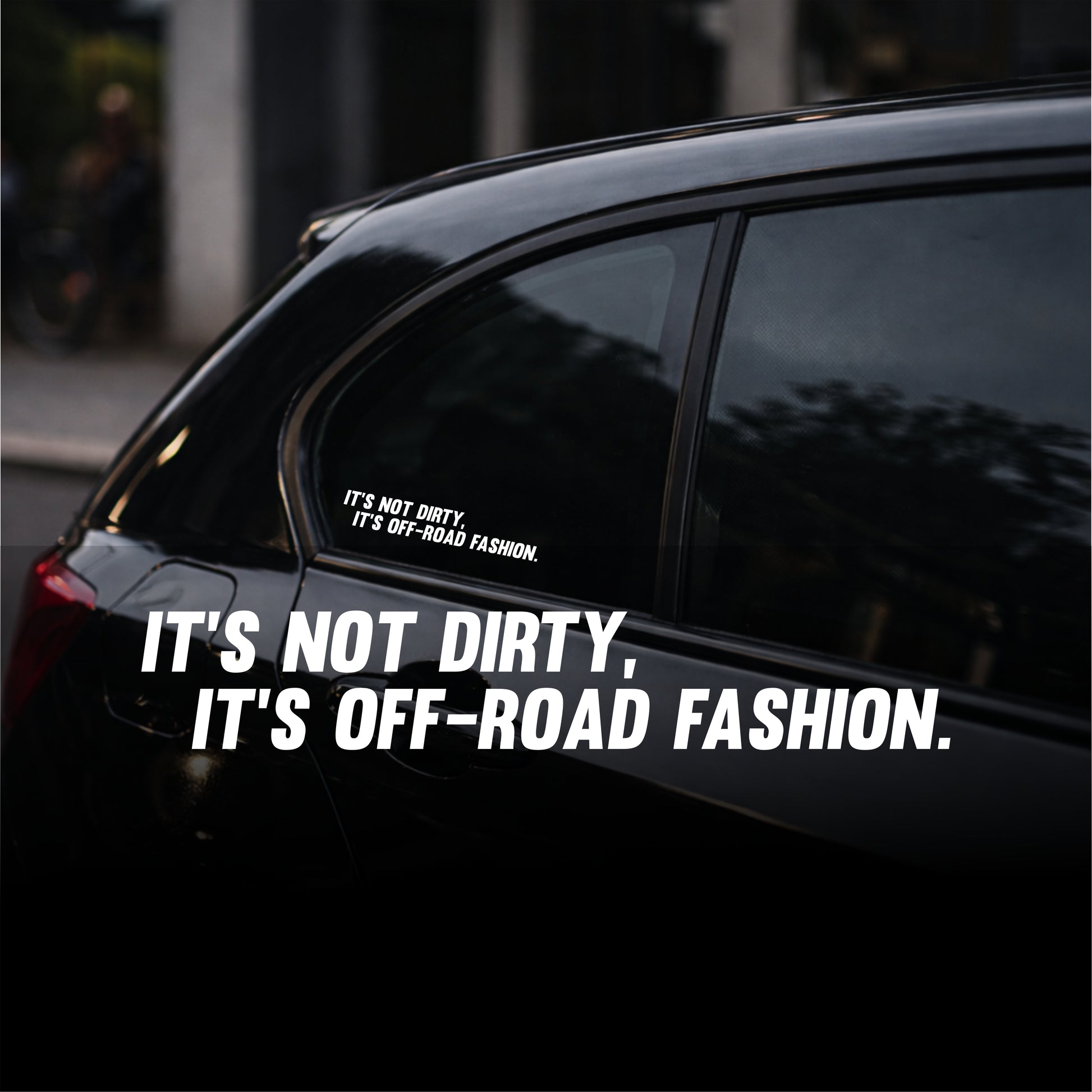 Car window with a decal reading 'It's not dirty, it's off-road fashion.'