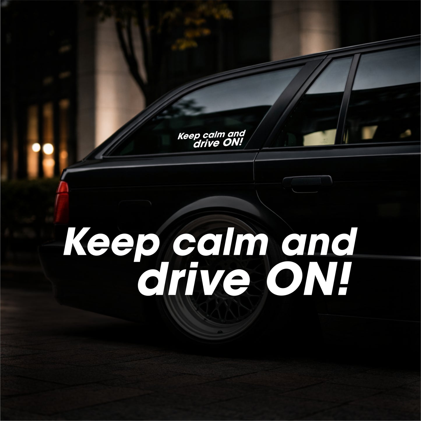 Black car with 'Keep calm and drive ON!' decal on a dark background
