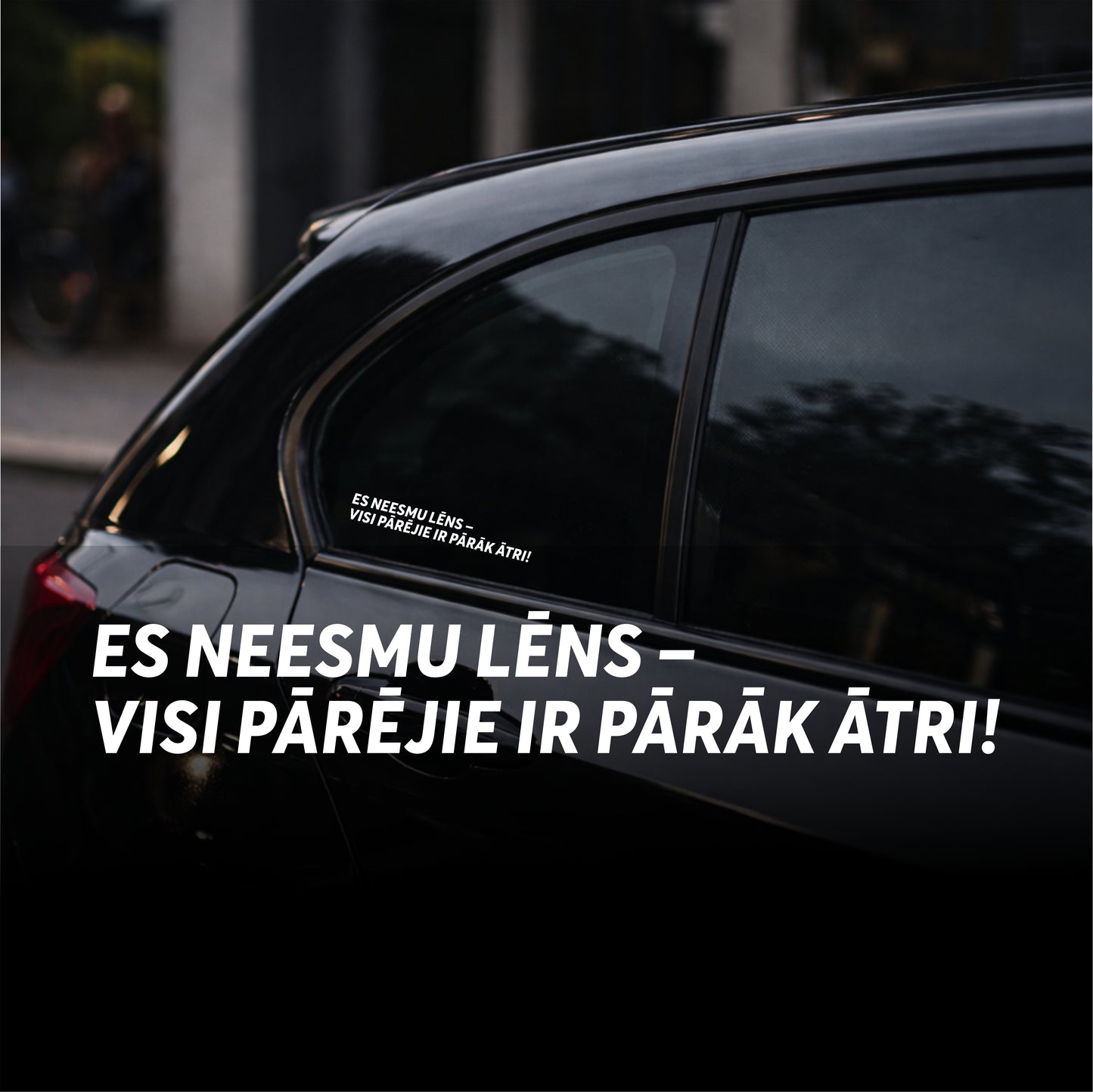 Car window with a humorous text sticker in a foreign language