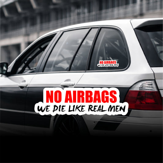 Car with humorous 'No Airbags' decal on a blurred background