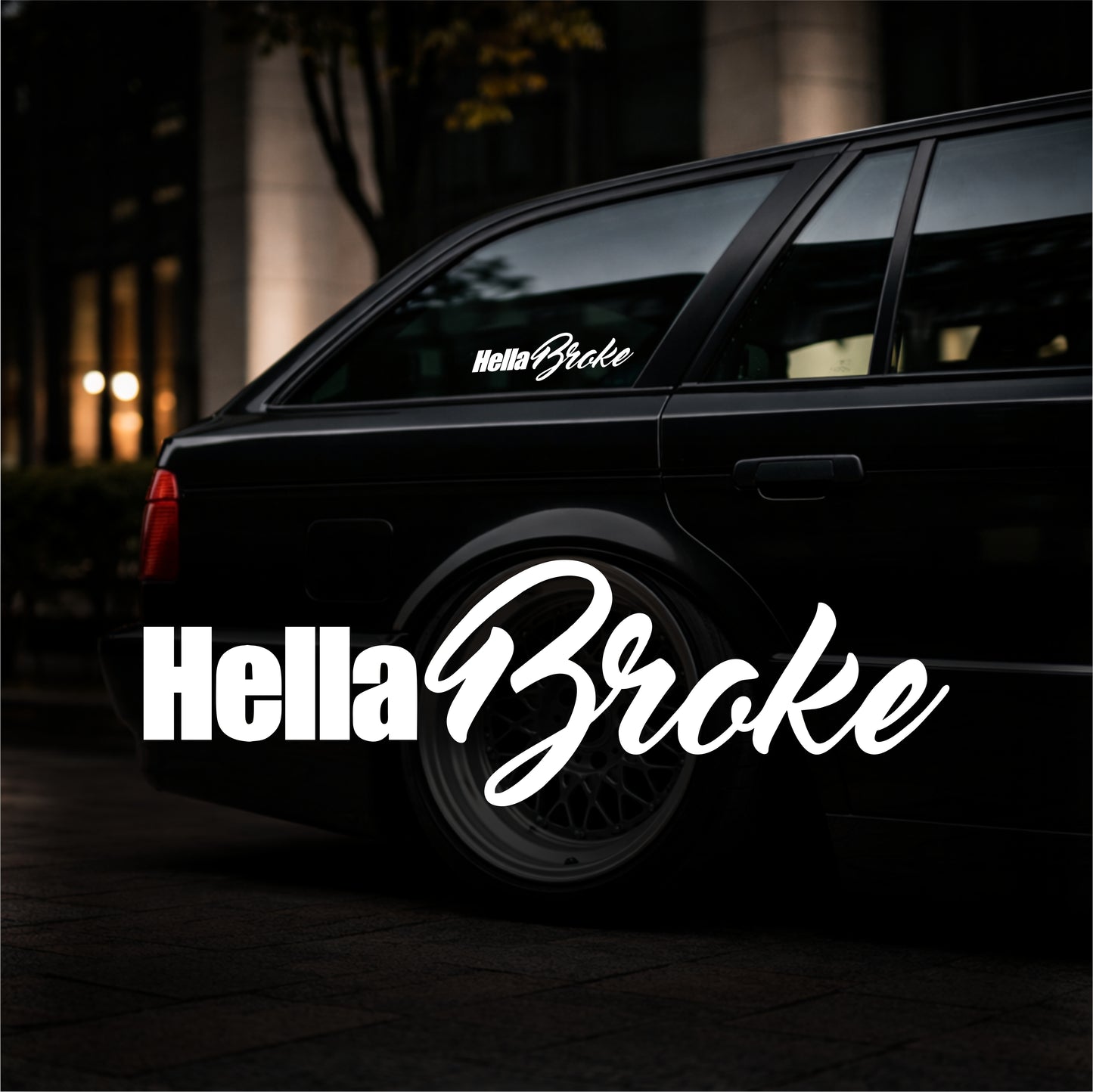 Black car with 'Hella Broke' decal on a dark background