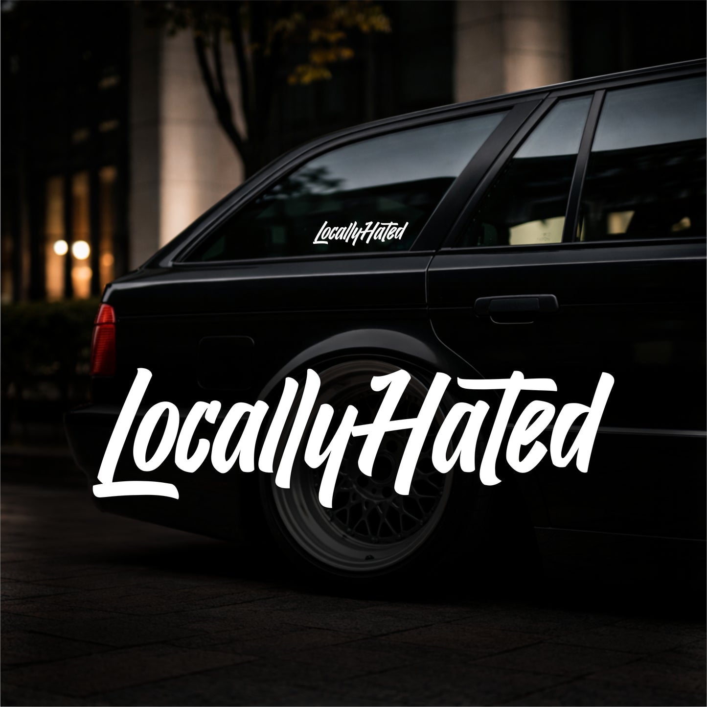 Black car with 'Locally Hated' decal on a dark background