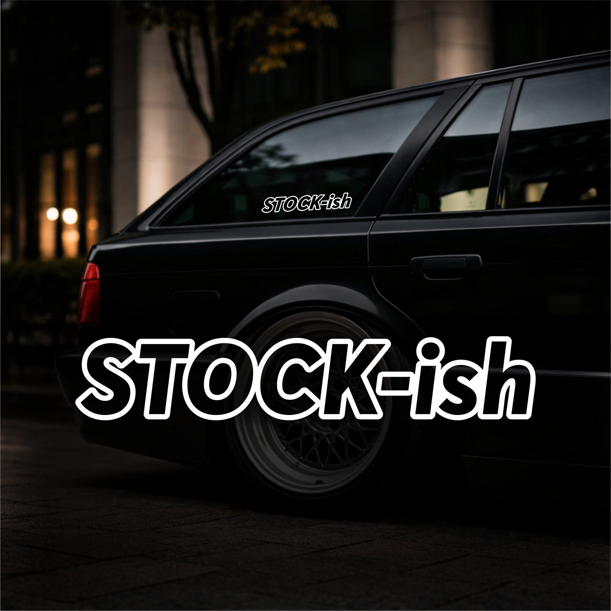 Black car with 'STOCK-ish' decal on a dark background