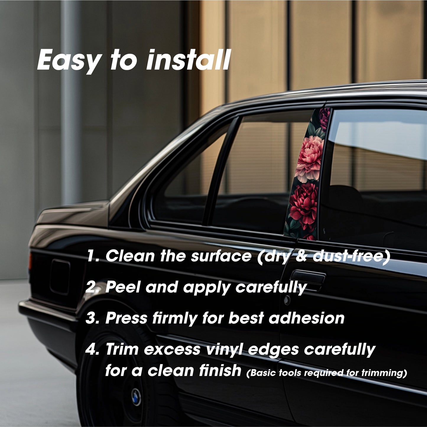 Car window with floral design sticker and installation instructions on a blurred background