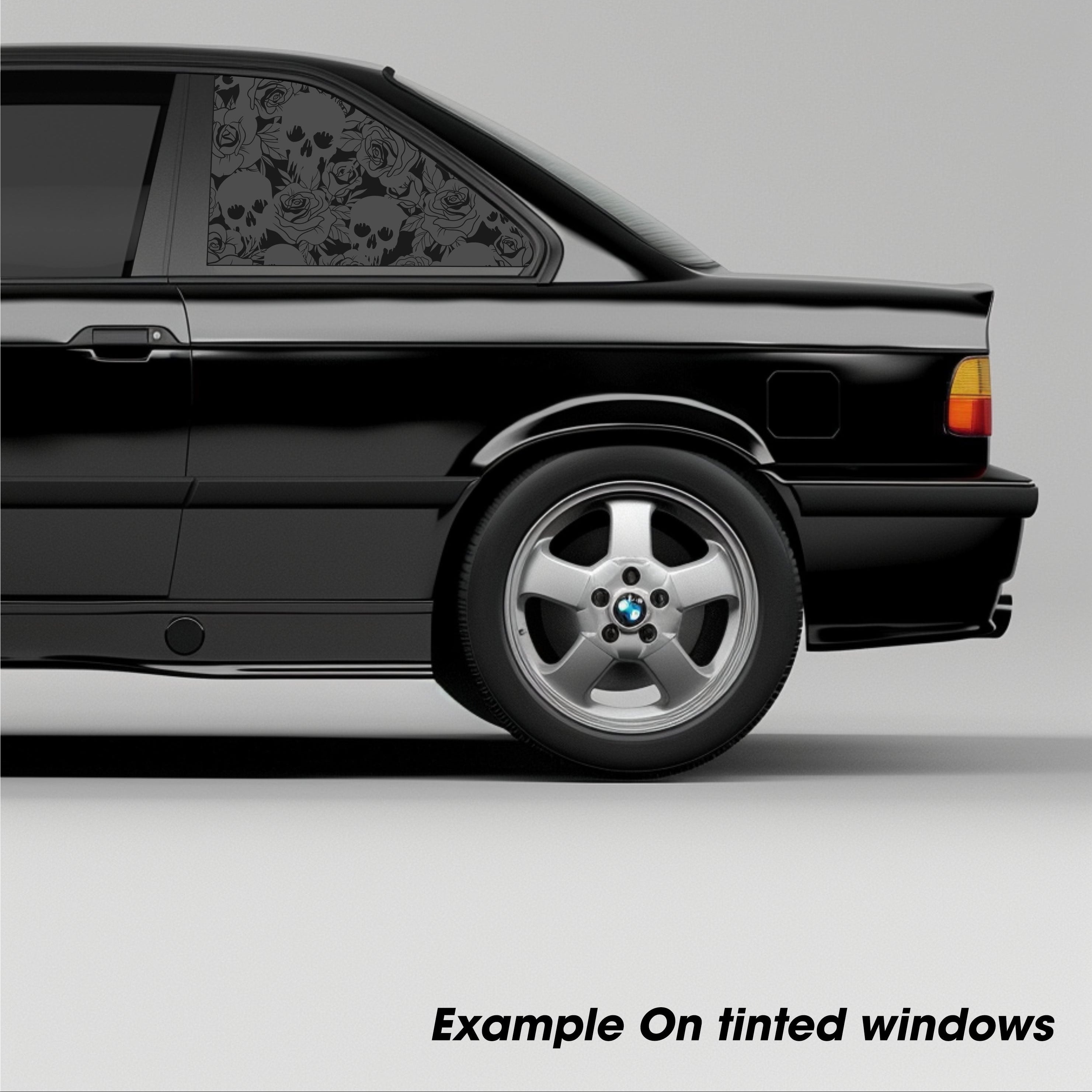 Black car with window tint on a gray background