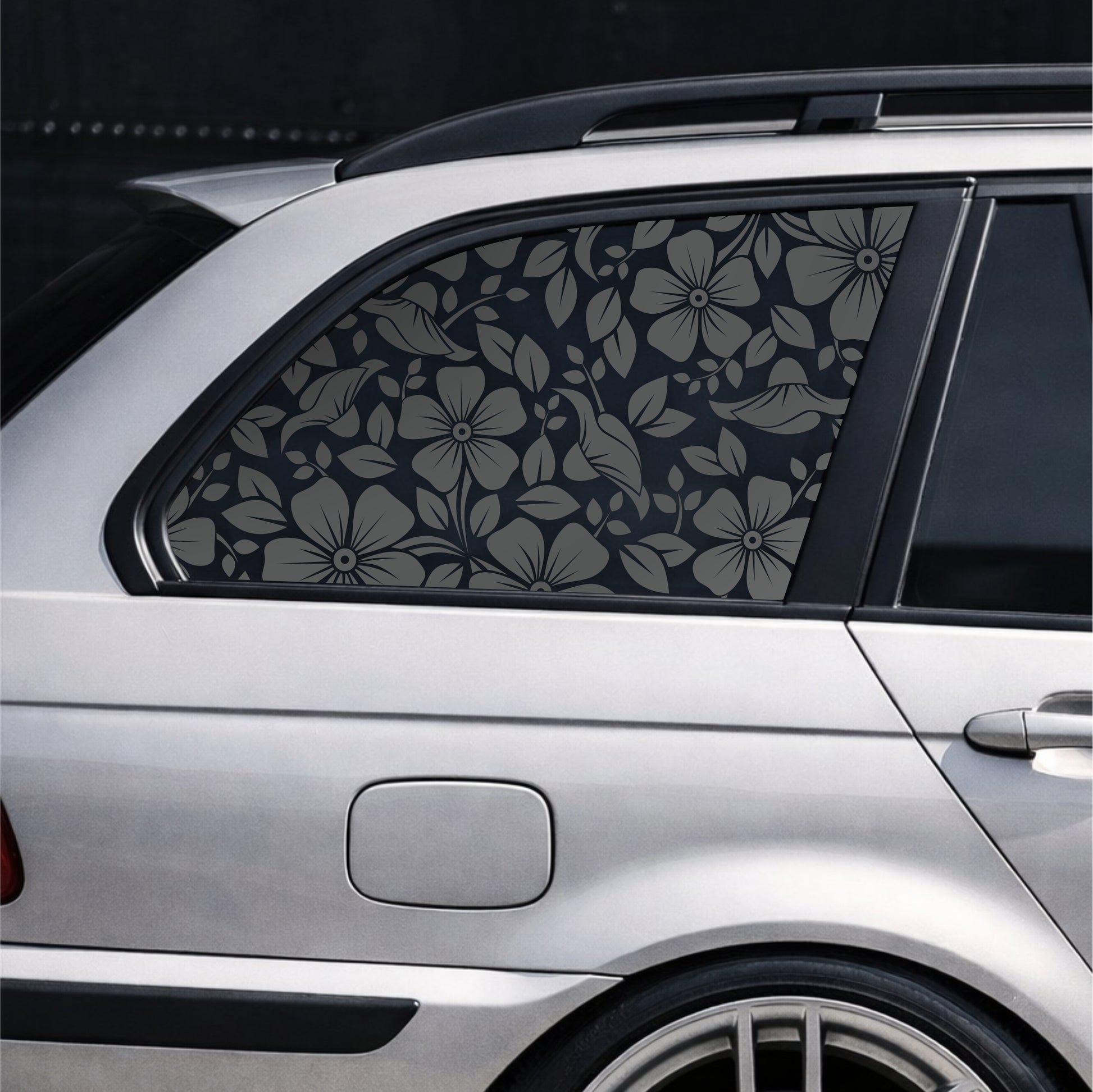 Car window with floral patterned film on a dark background Black Matt SPRING rear side window decal on silver BMW