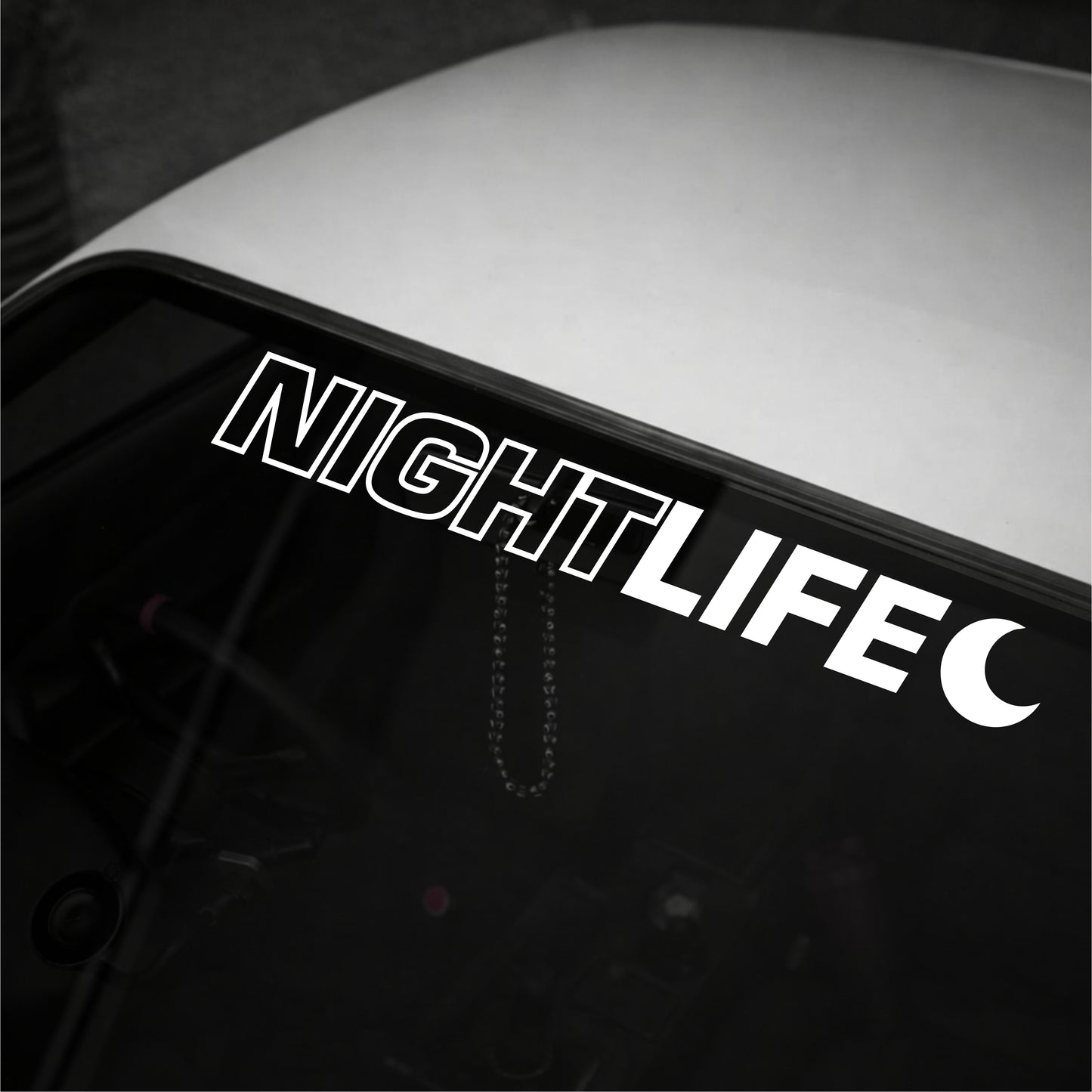 Decal with 'NIGHTLIFE' text on a vehicle's window