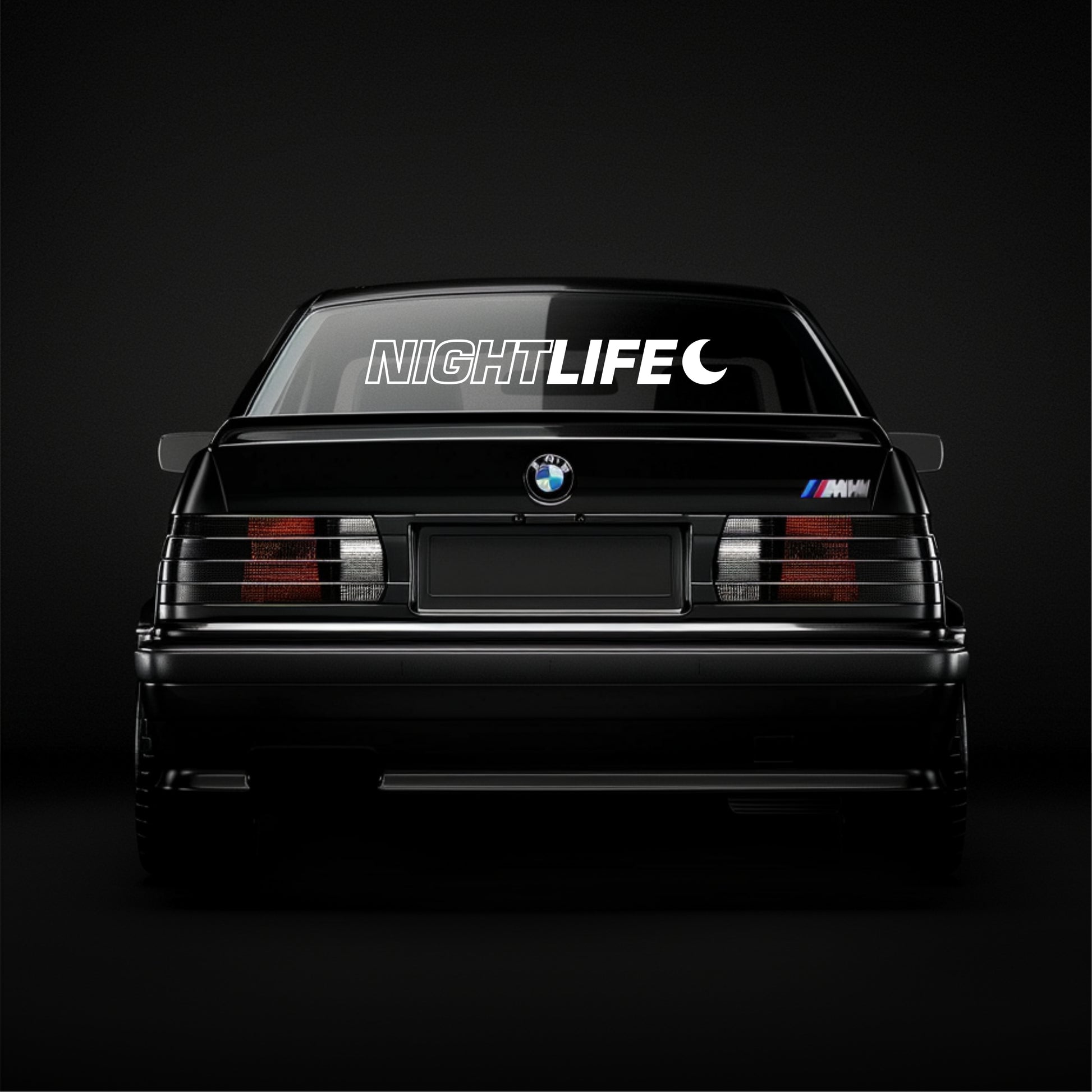 BMW car with 'NIGHTLIFE' decal on a black background