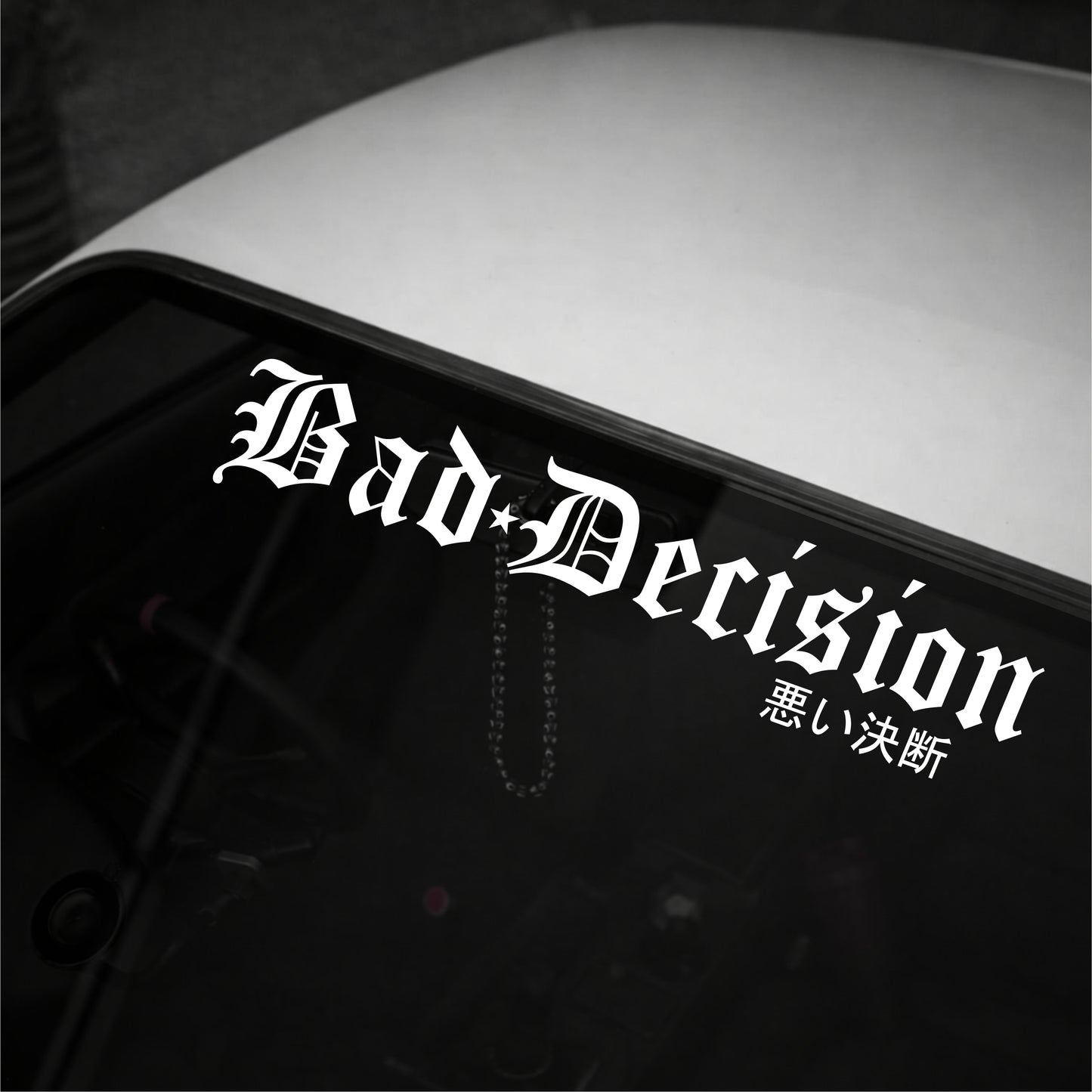 Decal with 'Bad Decision' text on a vehicle's window