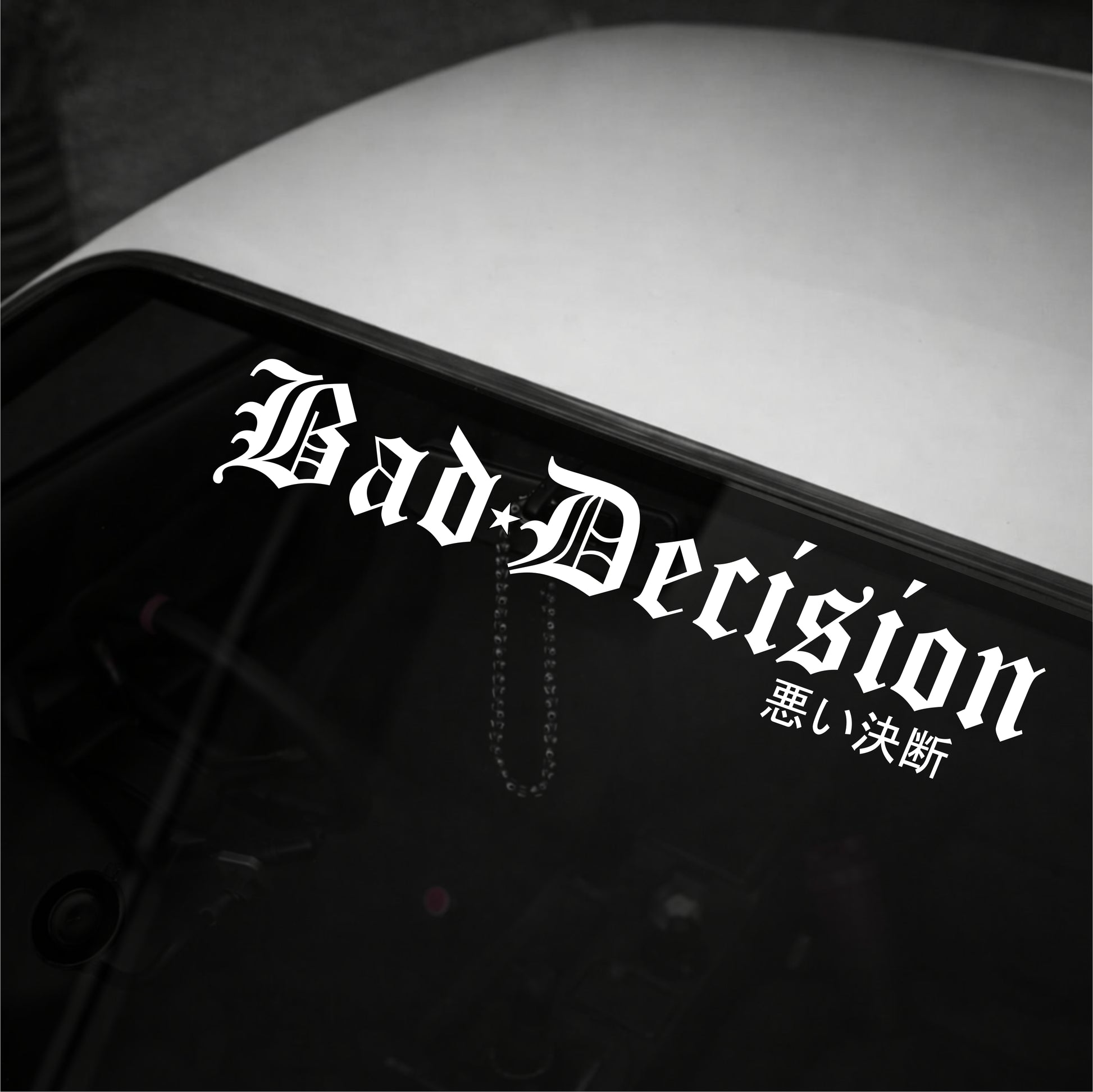 Decal with 'Bad Decision' text on a vehicle's window