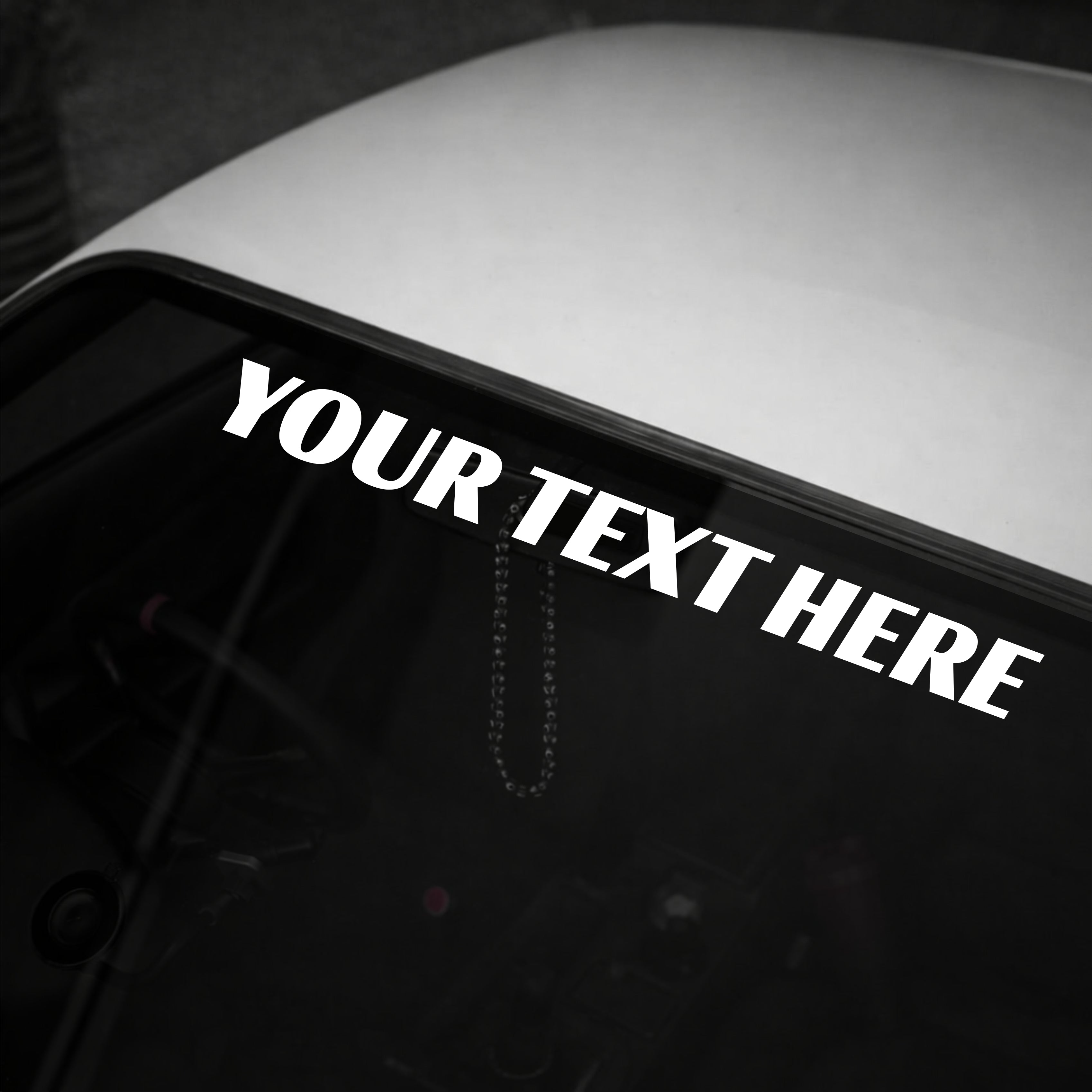 Personalized text decal on a car window with 'YOUR TEXT HERE' text.