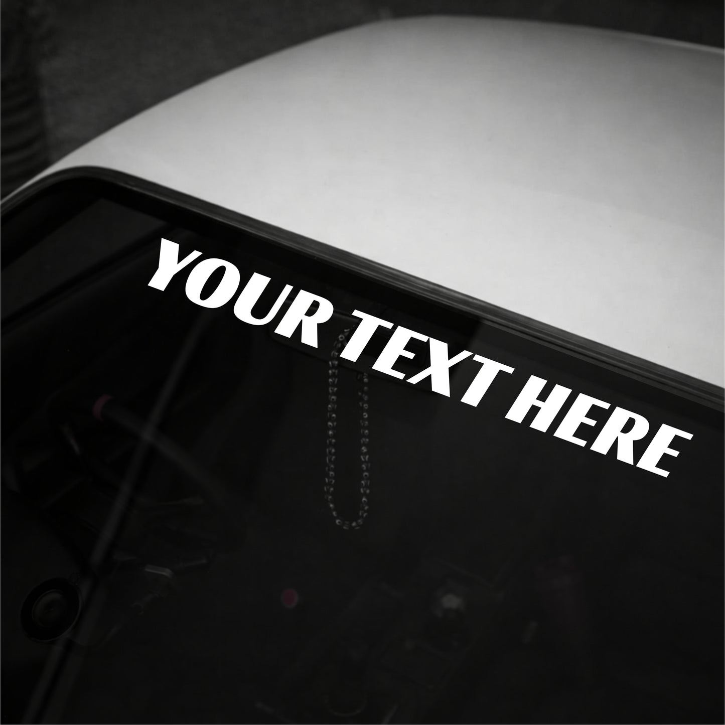 Personalized text decal on a car window with 'YOUR TEXT HERE' text.