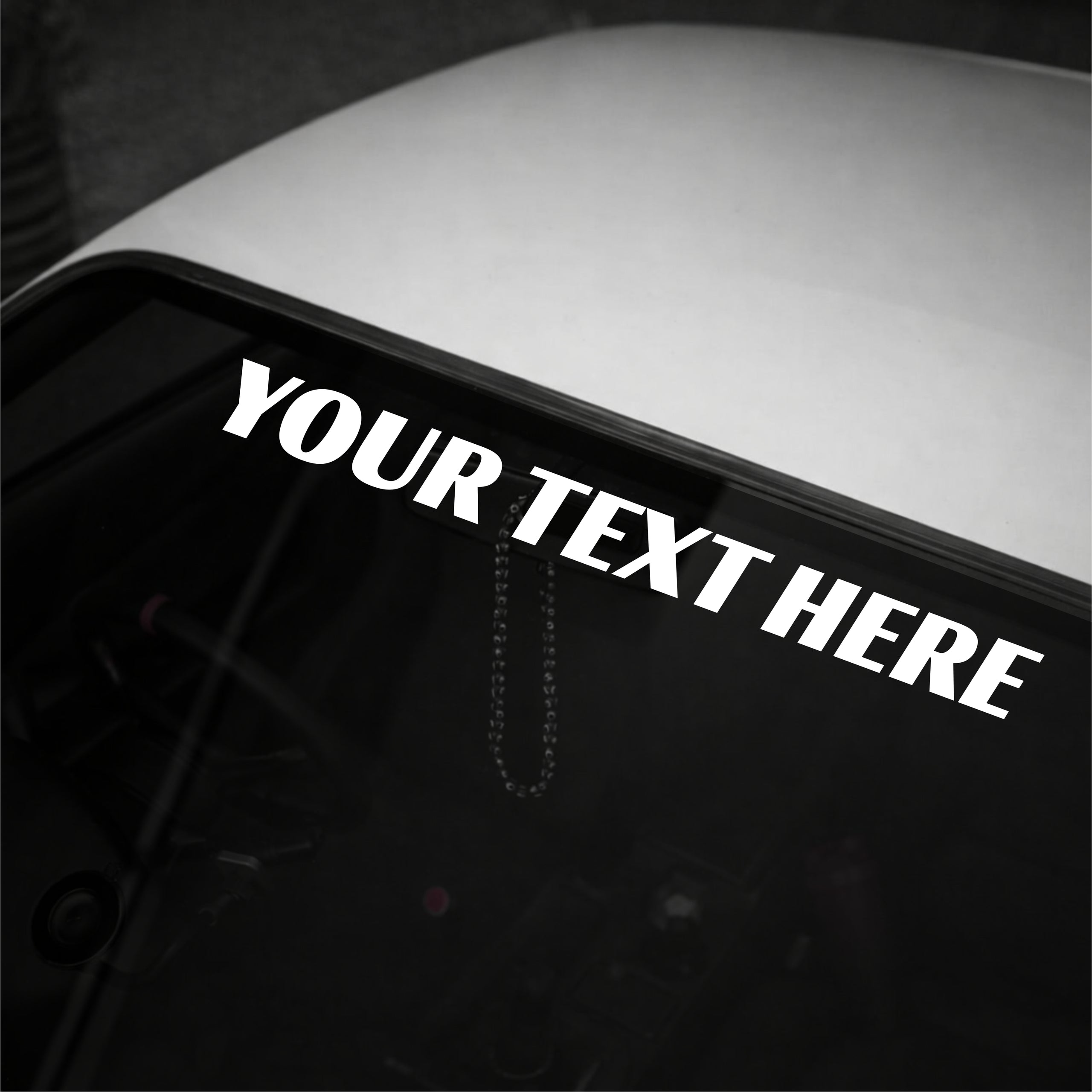 Personalized text decal on a car window with 'YOUR TEXT HERE' text.