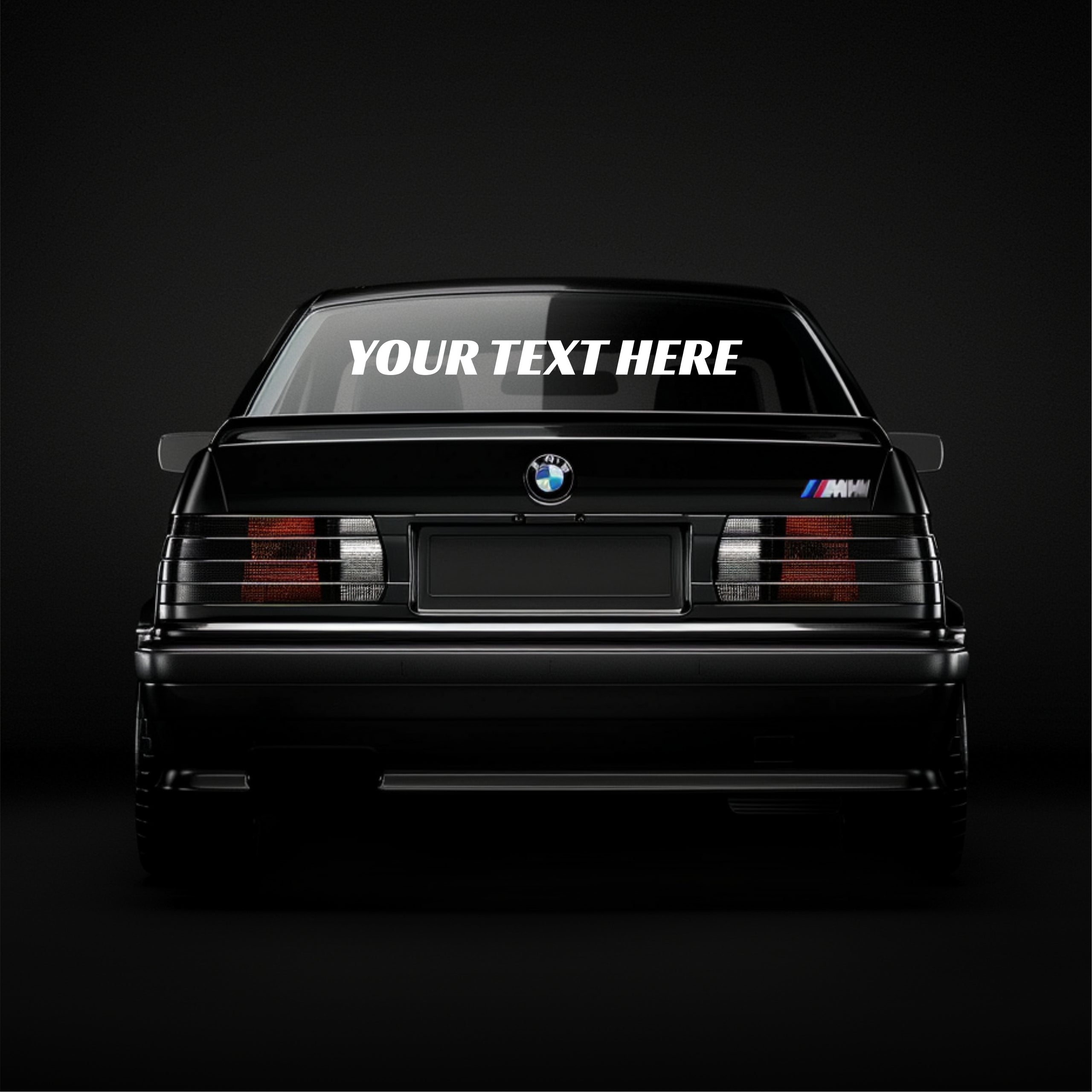 Black BMW car with customizable text on a dark background