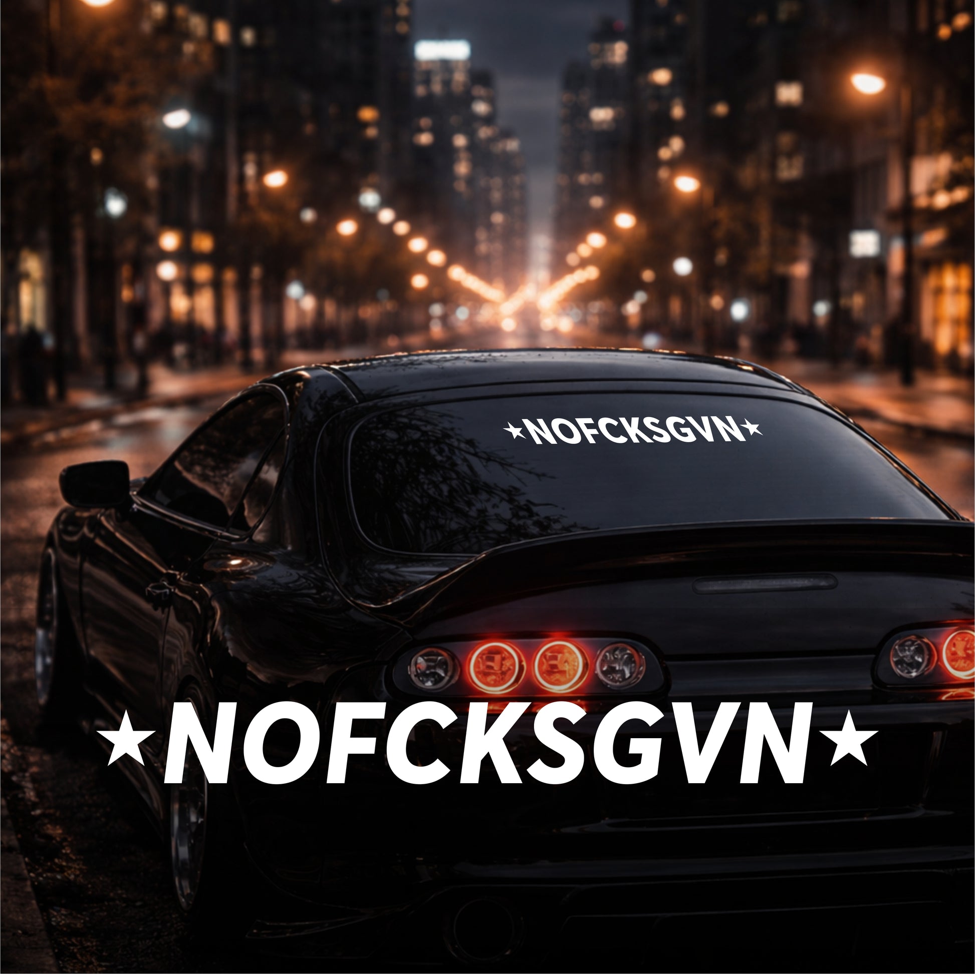 Car with 'NOFCKSGVN' text on a city street at night