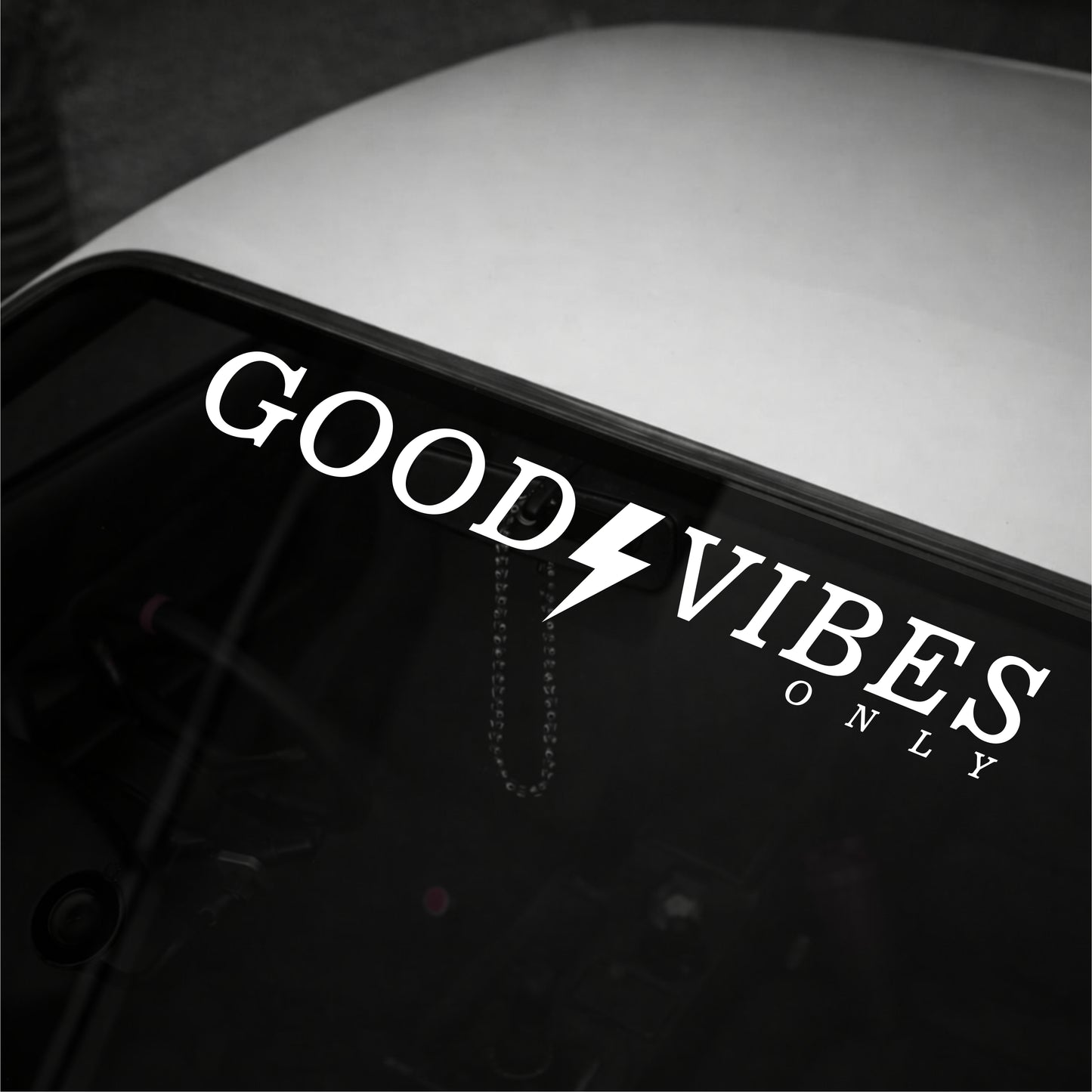 Decal with 'Good Vibes Only' text on a vehicle window