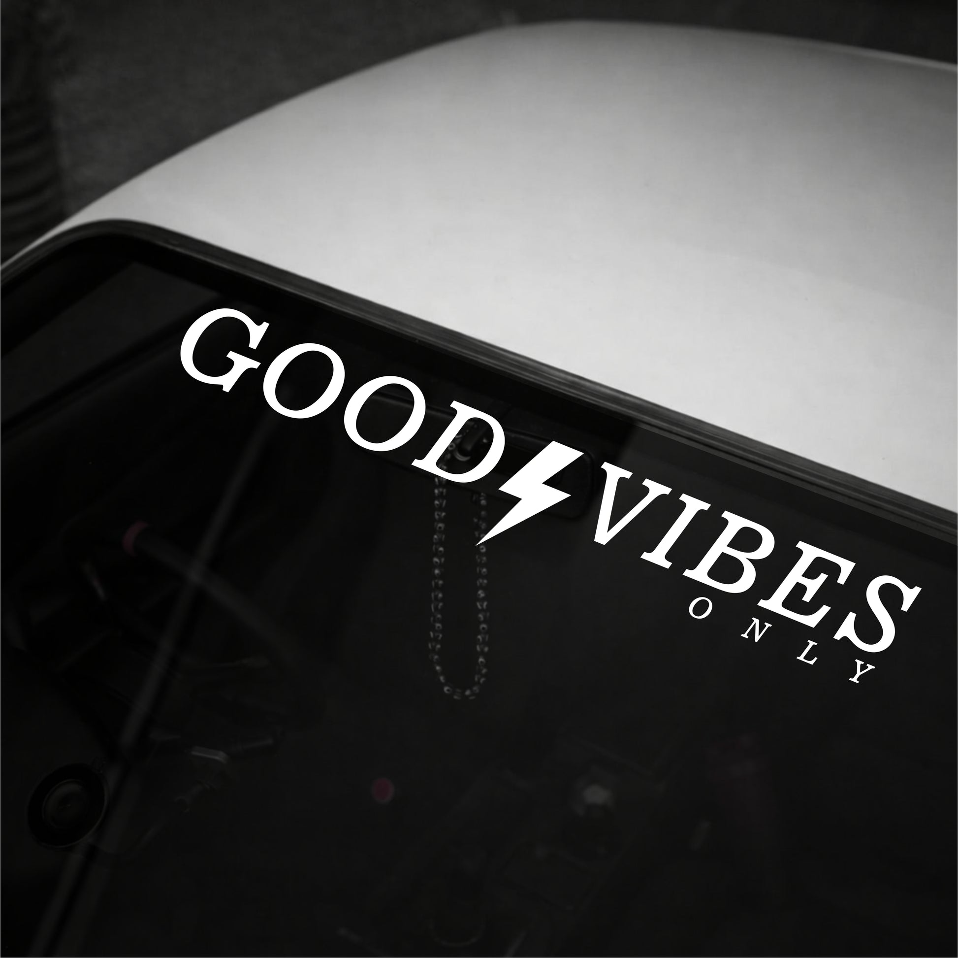 Decal with 'Good Vibes Only' text on a vehicle window