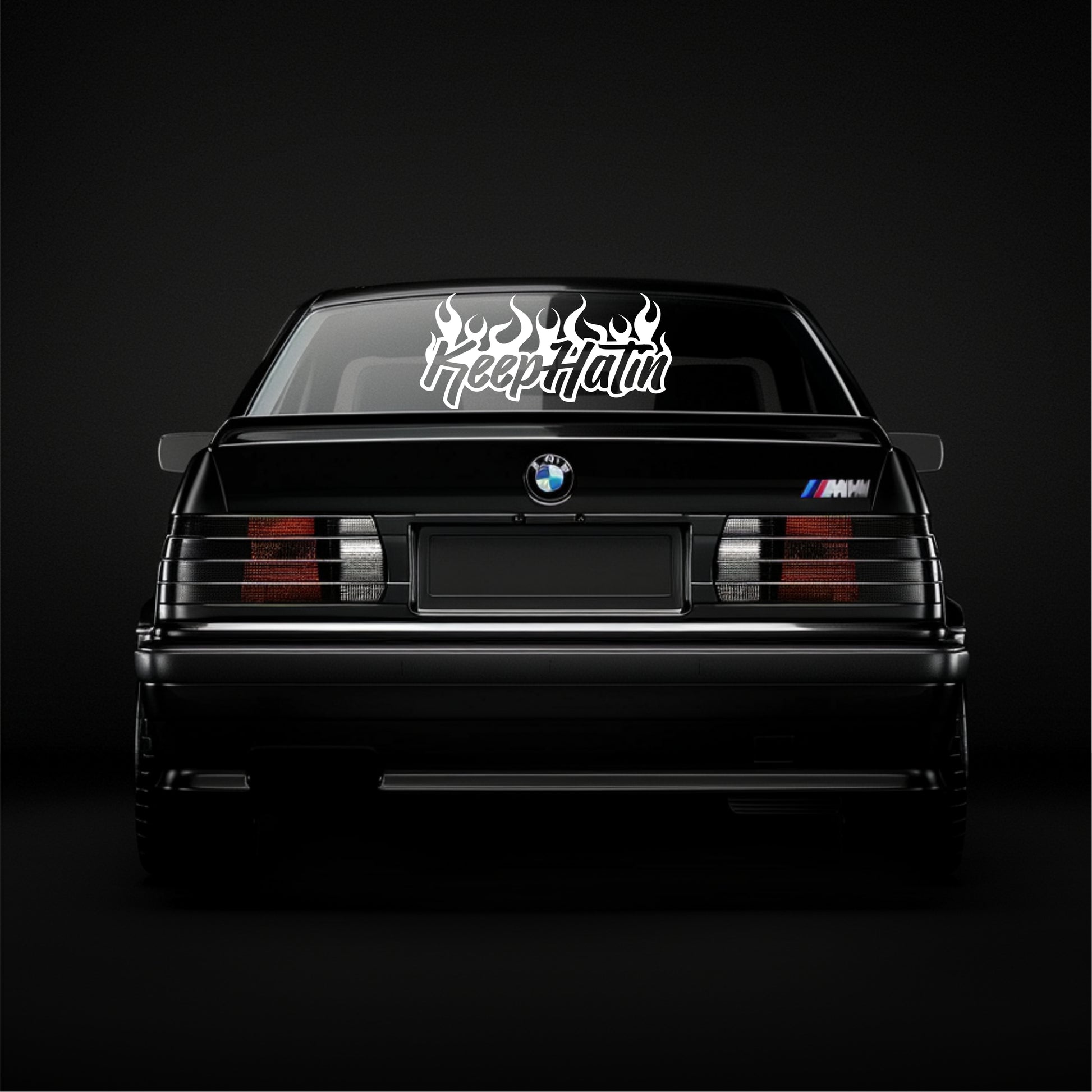 BMW car with 'Keep It Hot' decal on a black background