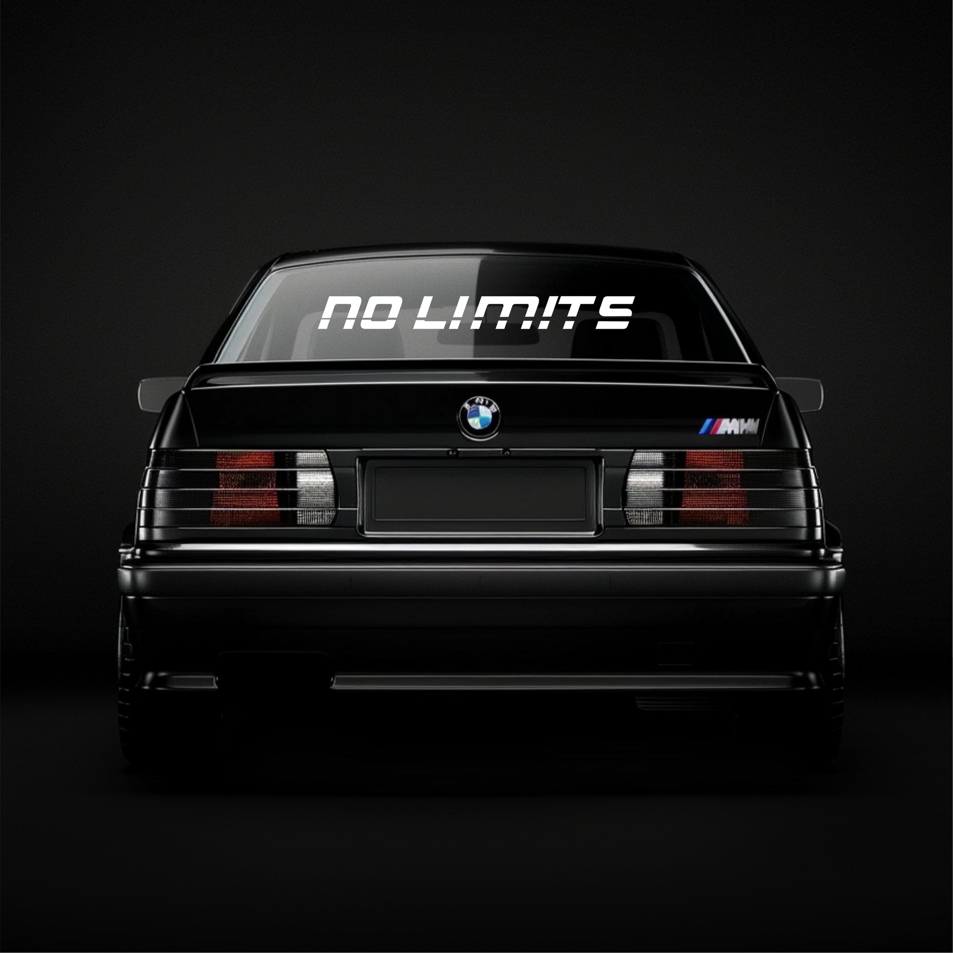 BMW car with 'NO LIMITS' decal on a black background