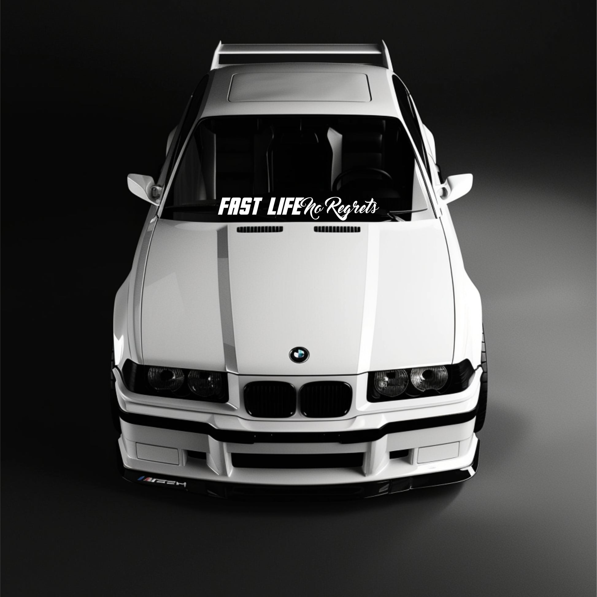 White BMW car with a 'Fast Life No Regrets' decal on a black background