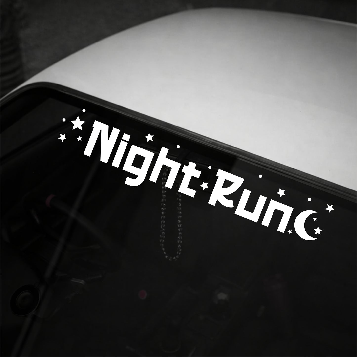 Decal with 'Night Run' text on a vehicle's window