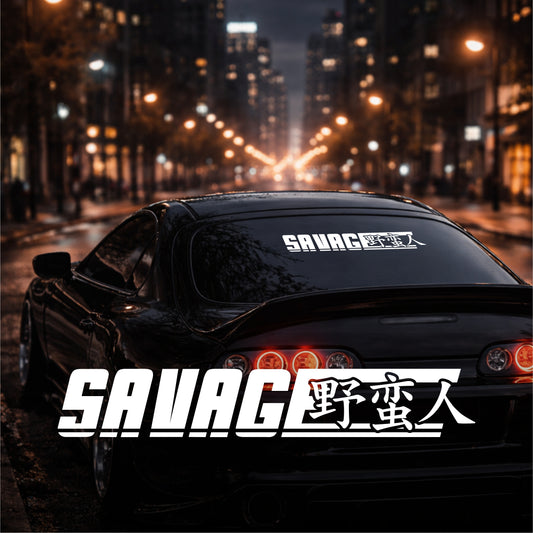 Car with 'SAVAGE' decals on a city street at night