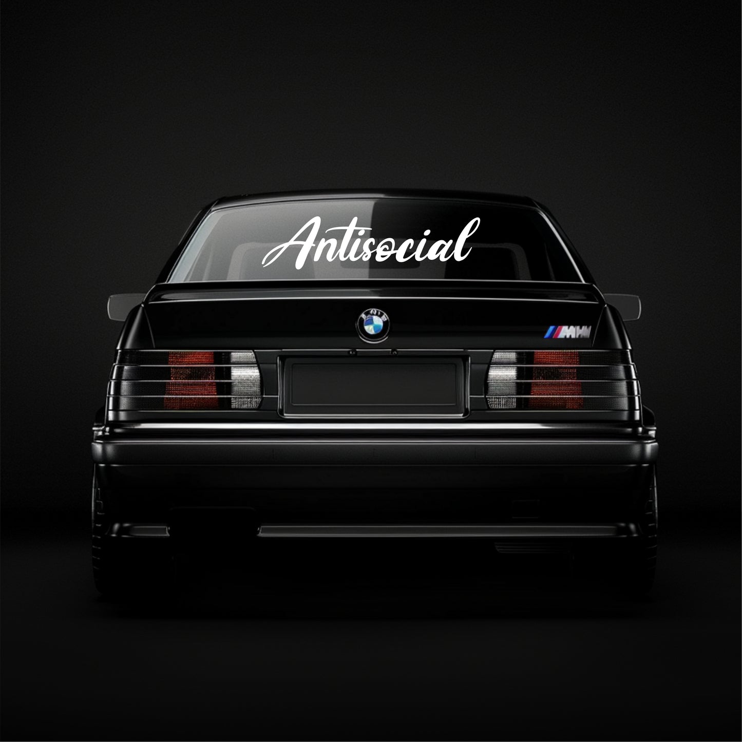 BMW car with 'Antisocial' decal on a black background