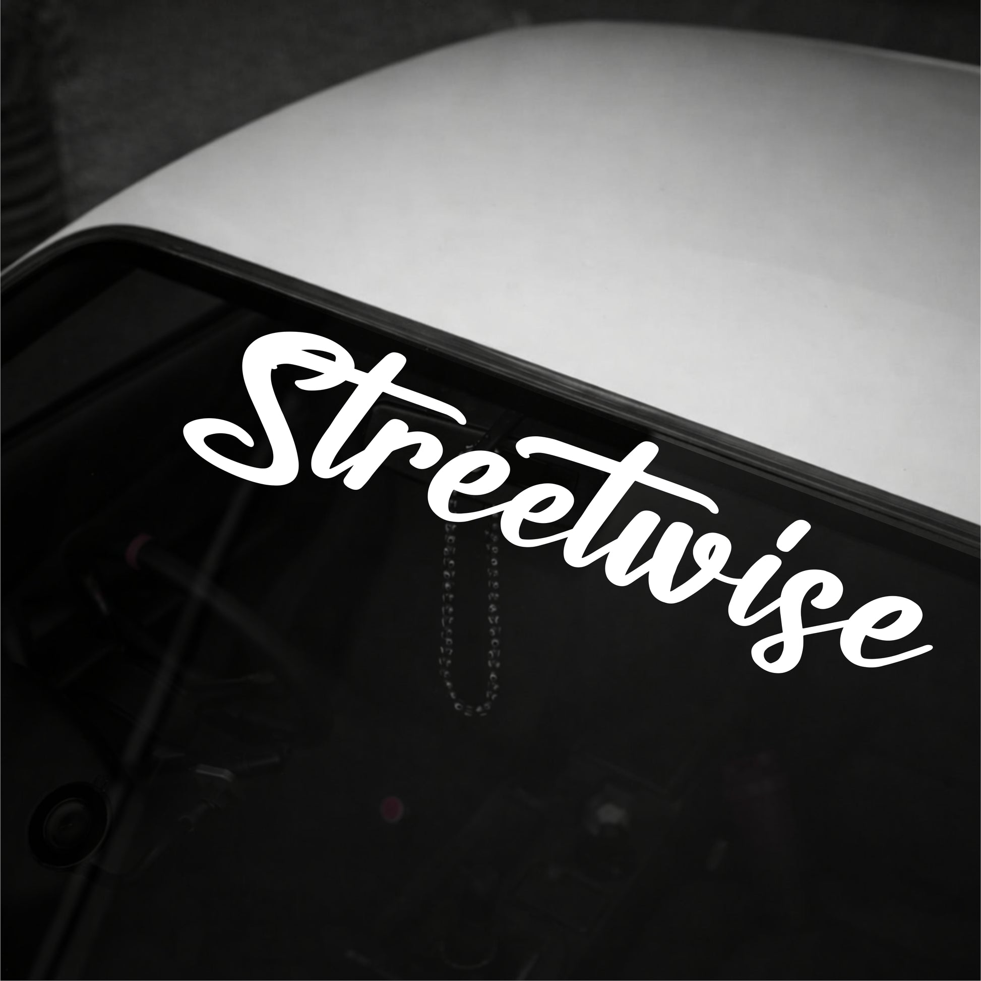 White 'Streetwise' decal on a car window