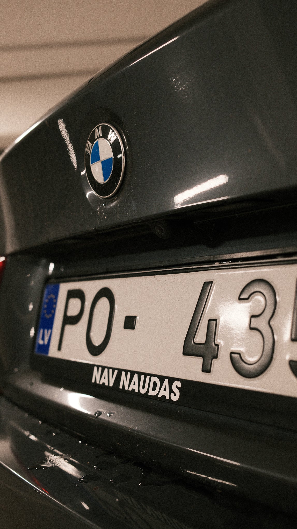 BMW car with a license plate and logo on a blurred background