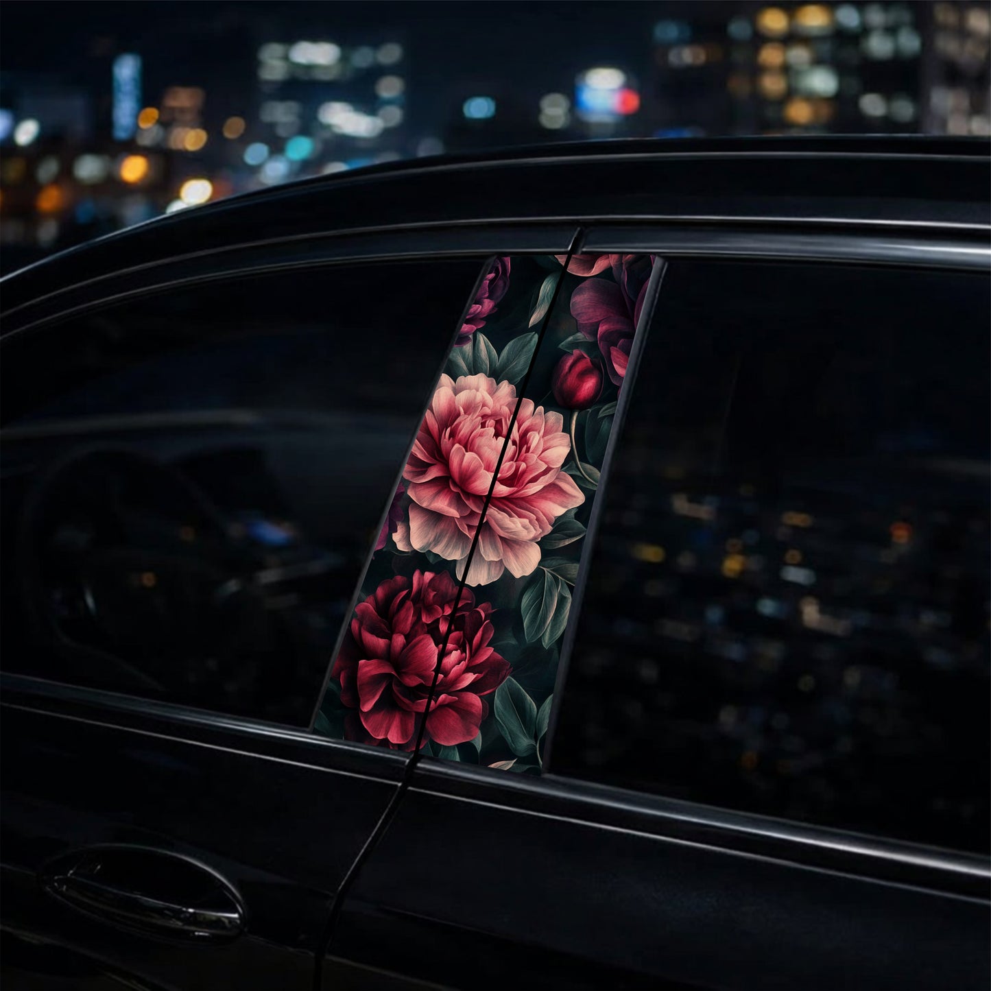 pillar sticker with floral design on a car window at night