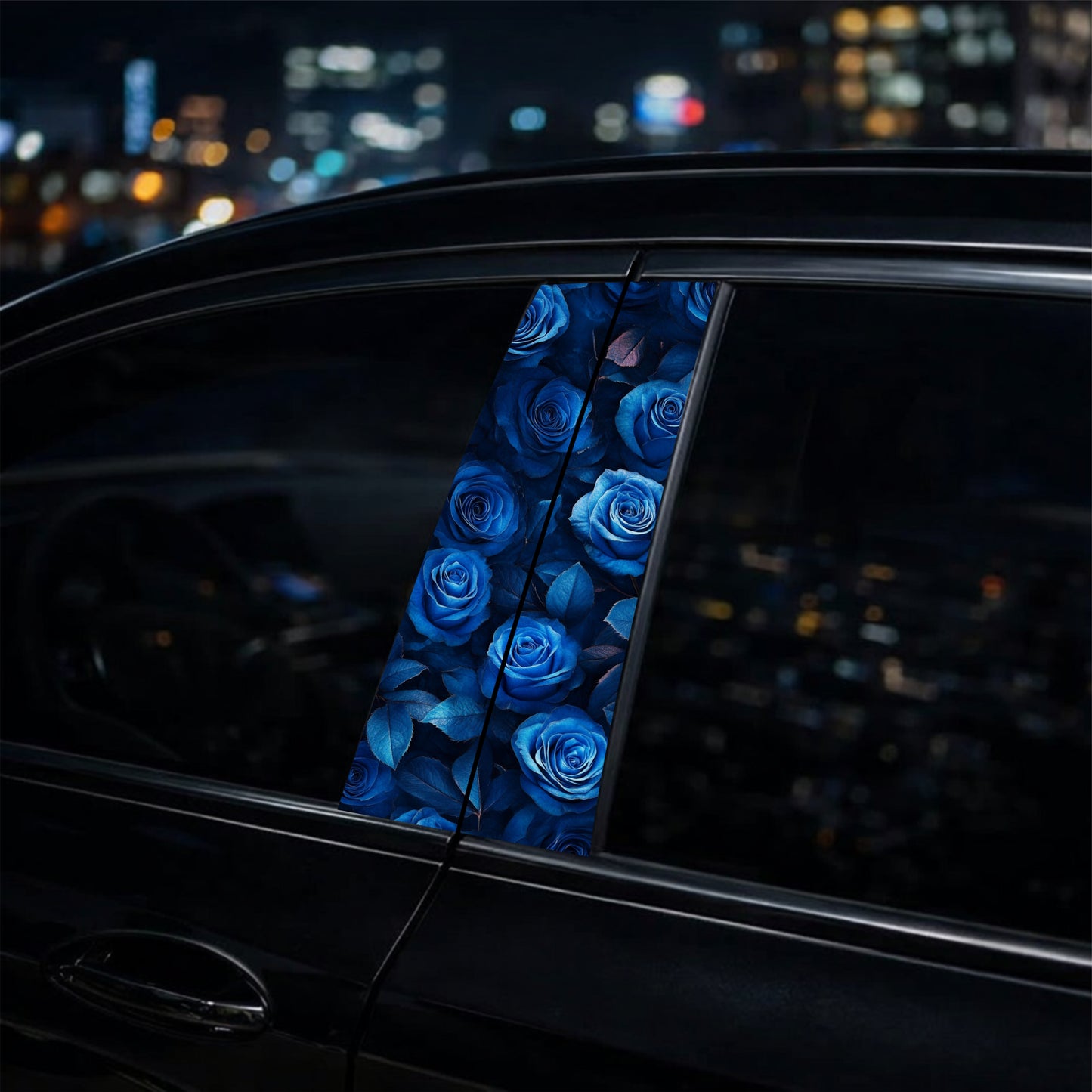 Car window with blue rose pattern against a cityscape at night