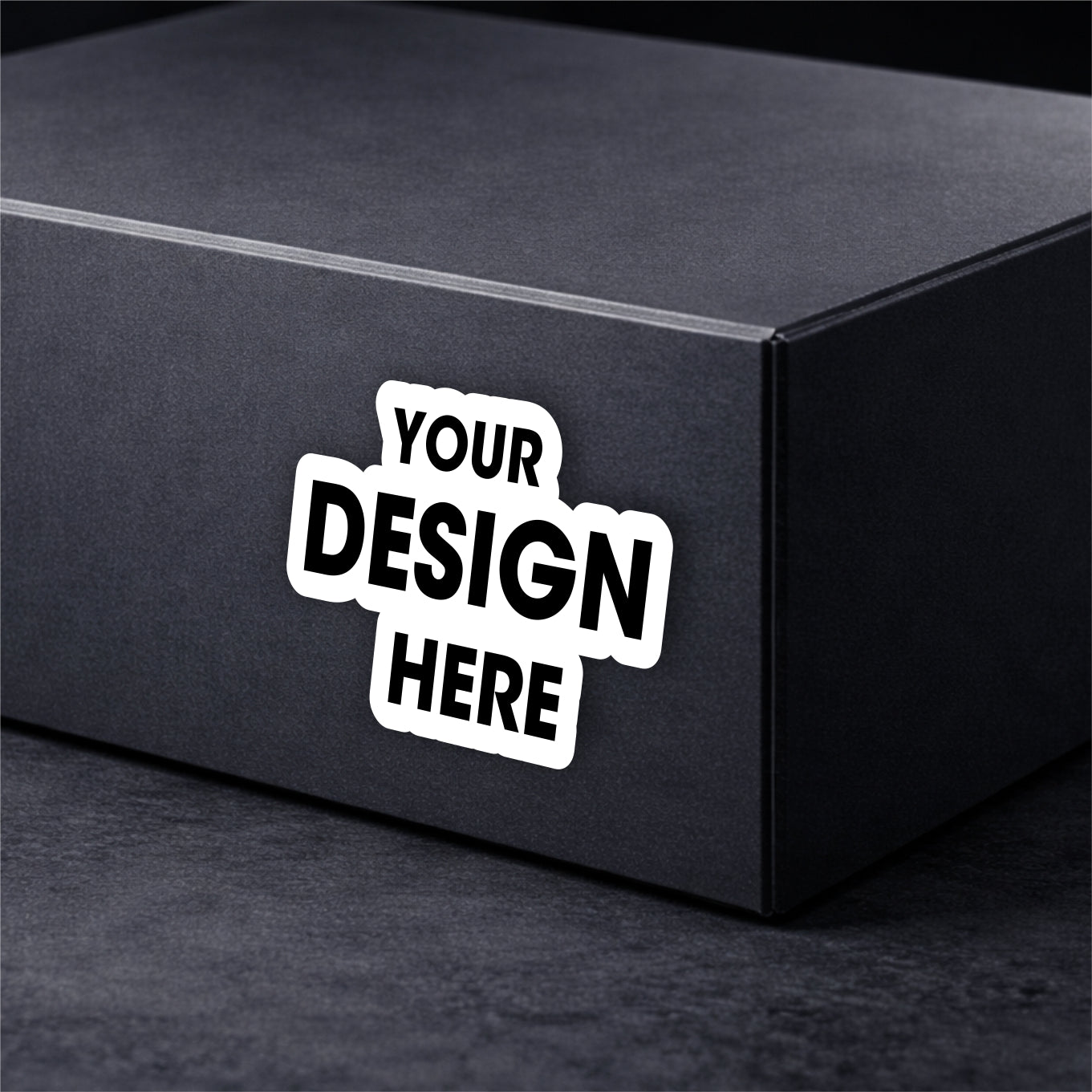 Black box with a customizable white sticker on a dark background
