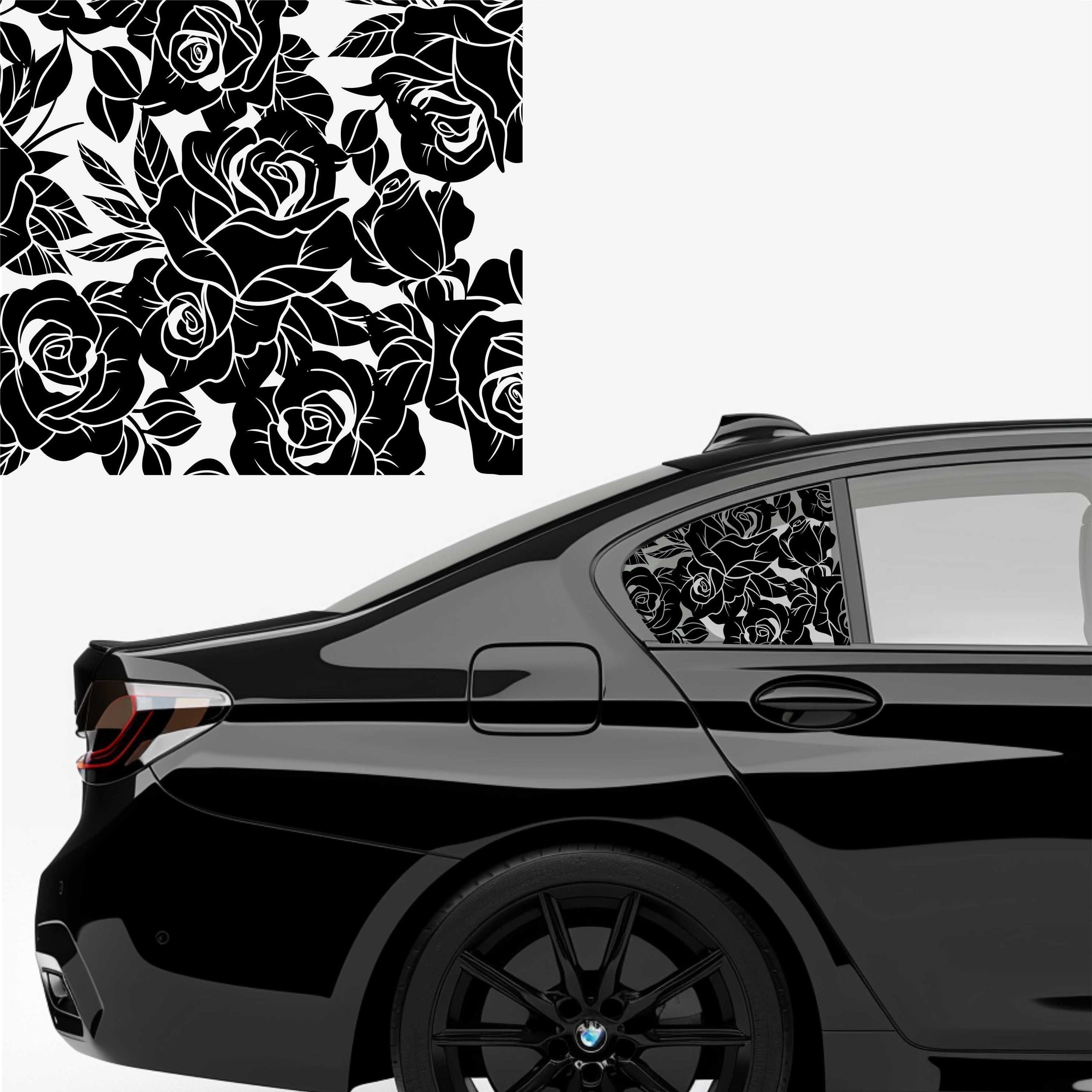 A black matte decal with a rose pattern applied to the side window of a car.